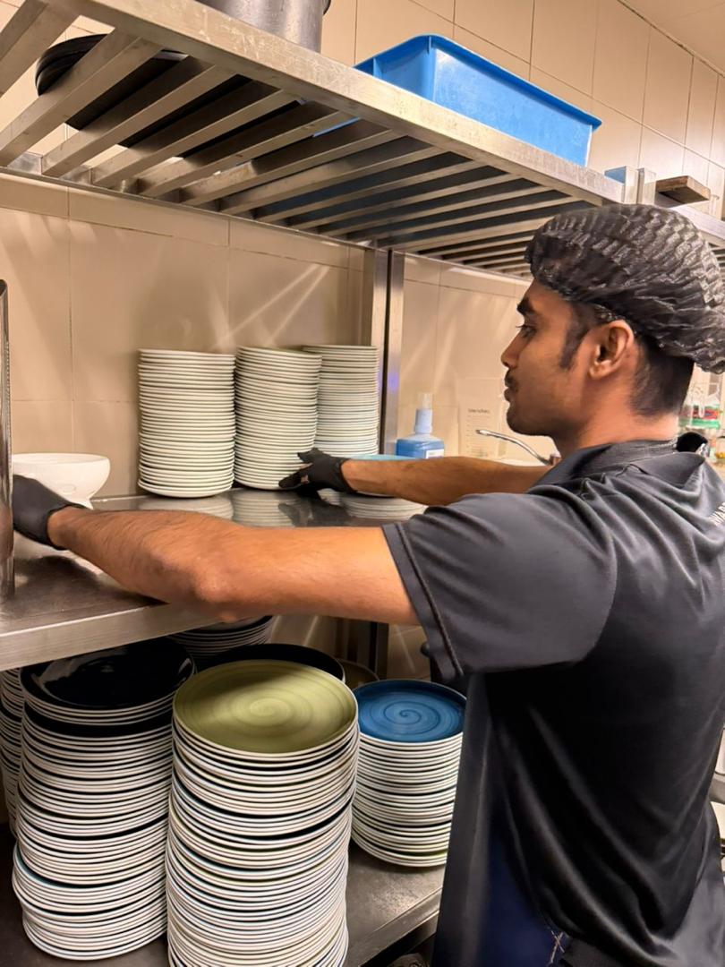 T&M steward operating commercial dishwash equipment